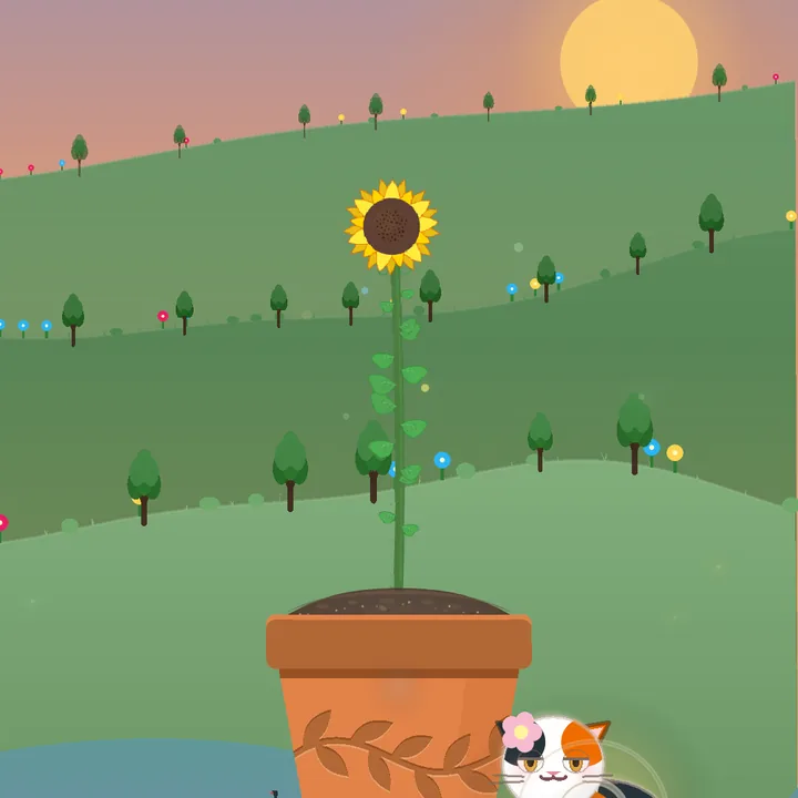 A sunflower growing in a pot on a green hillside